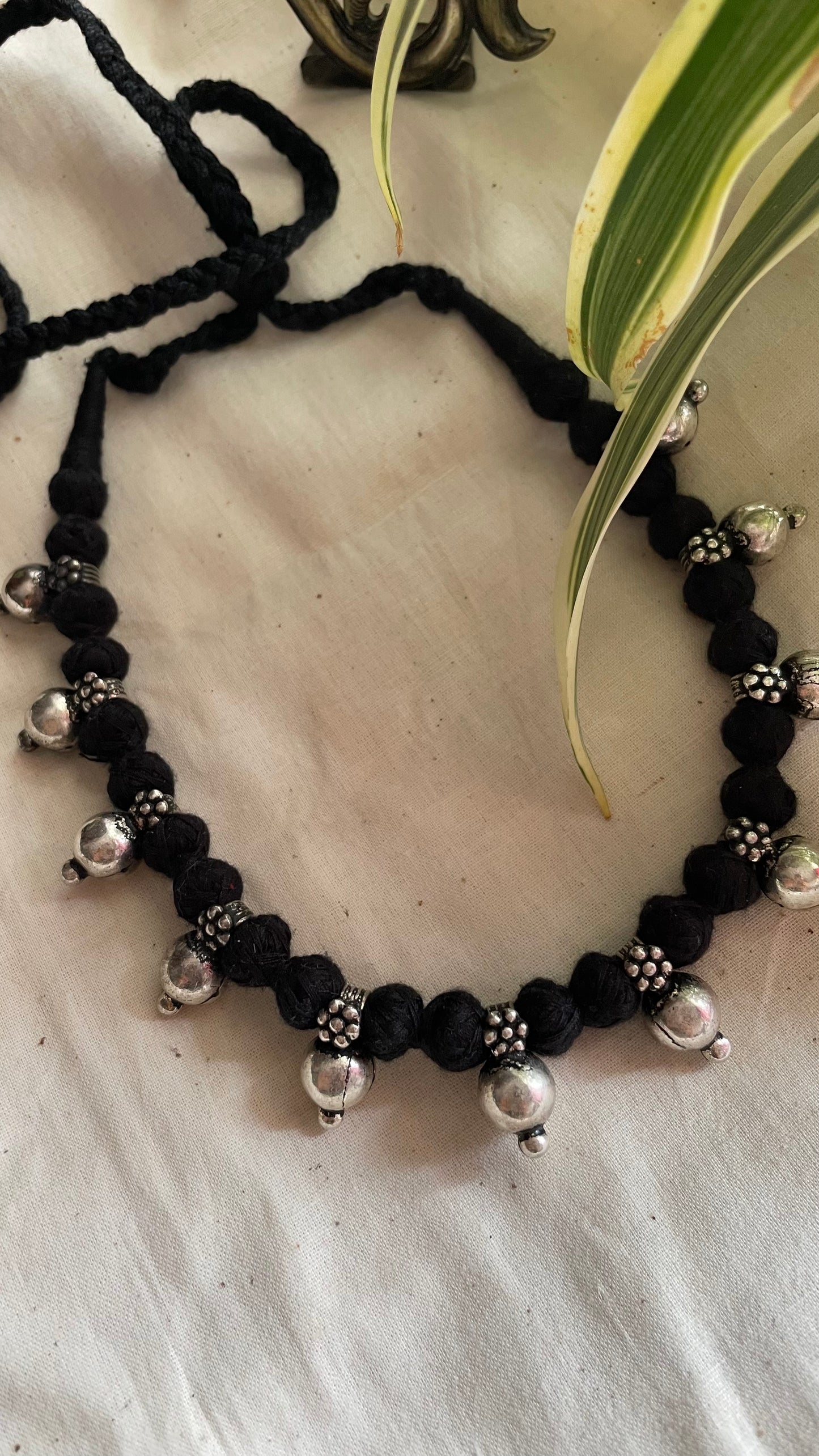 German silver beads in black Patwa threadwork neckpiece.