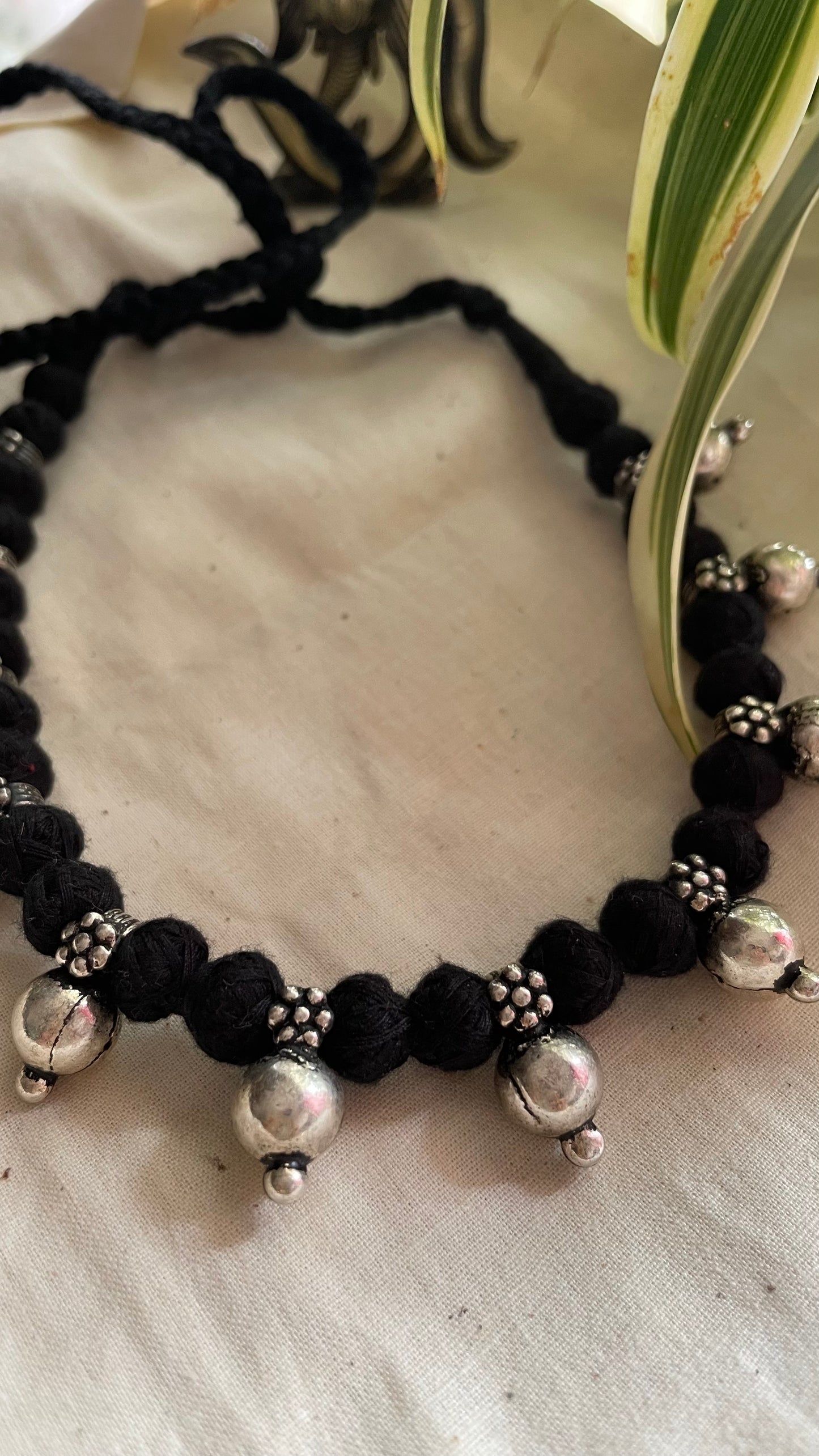 German silver beads in black Patwa threadwork neckpiece.