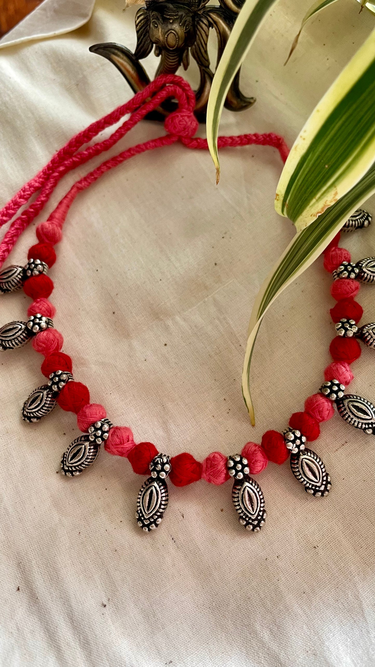 German silver beads in pink & red Patwa threadwork neckpiece.