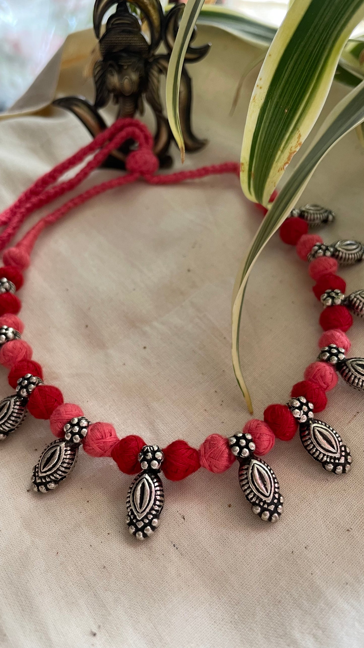 German silver beads in pink & red Patwa threadwork neckpiece.